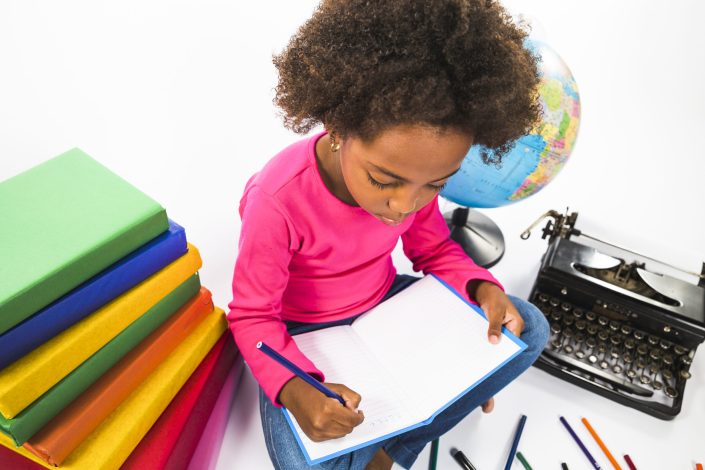 kid-writing-notebook-studio